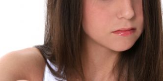 Teen Girl With Attittude Pointing Towards Camera